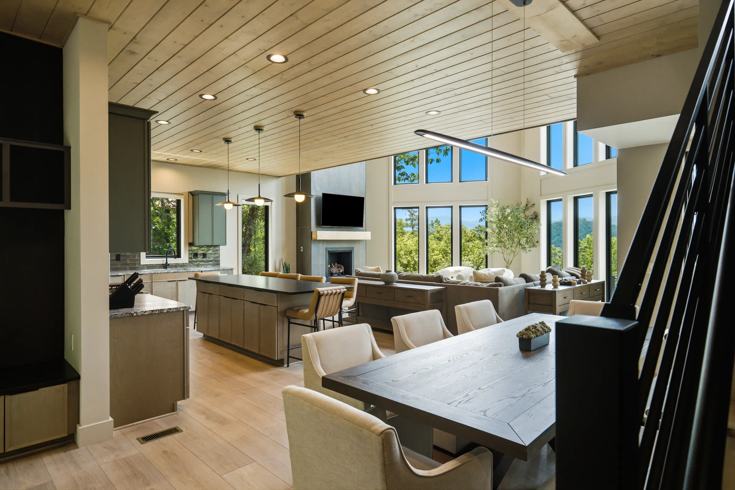 Dining room connecting the kitchen and mountain-facing great room