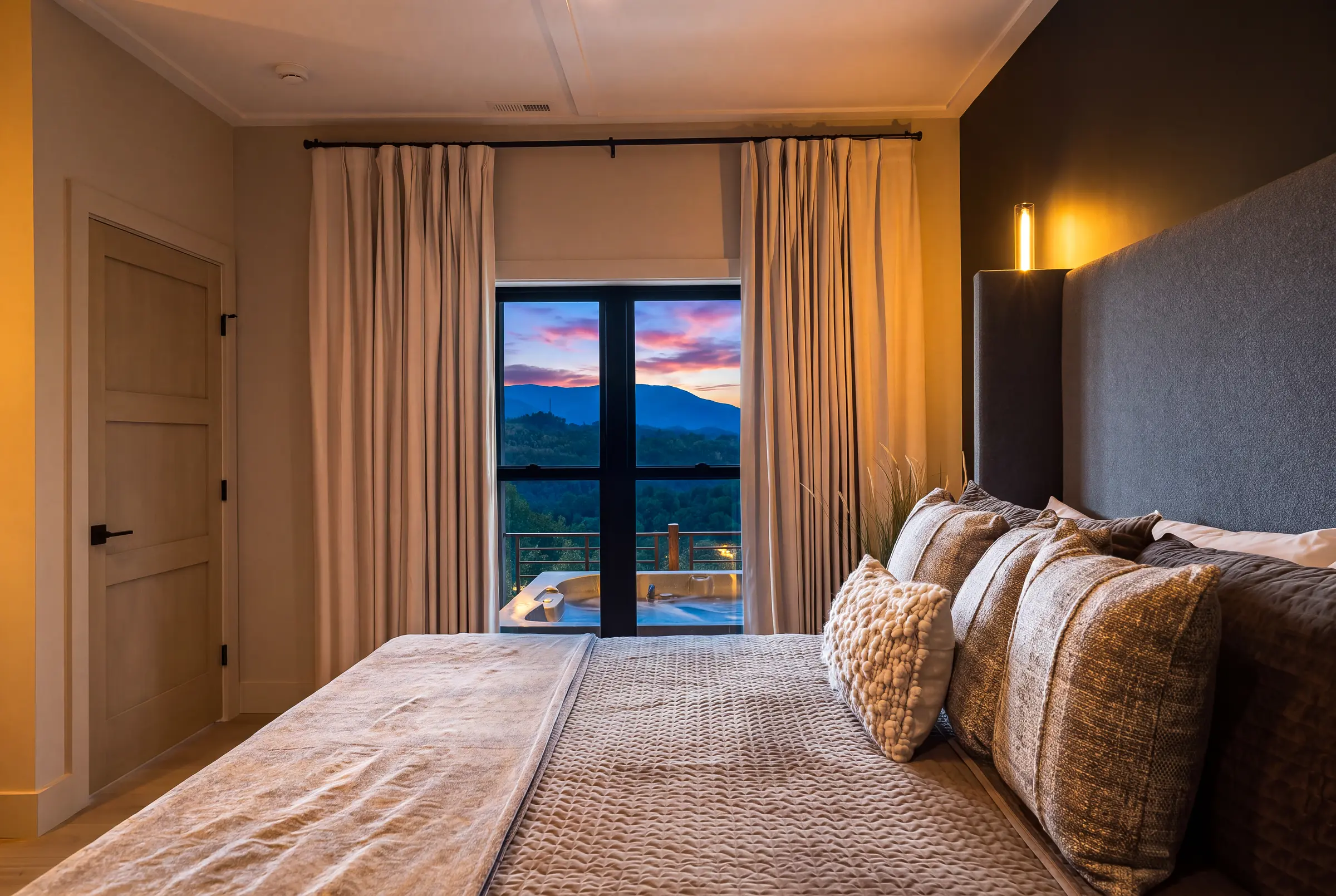Tailored guest suite opening toward the sunset and mountain view