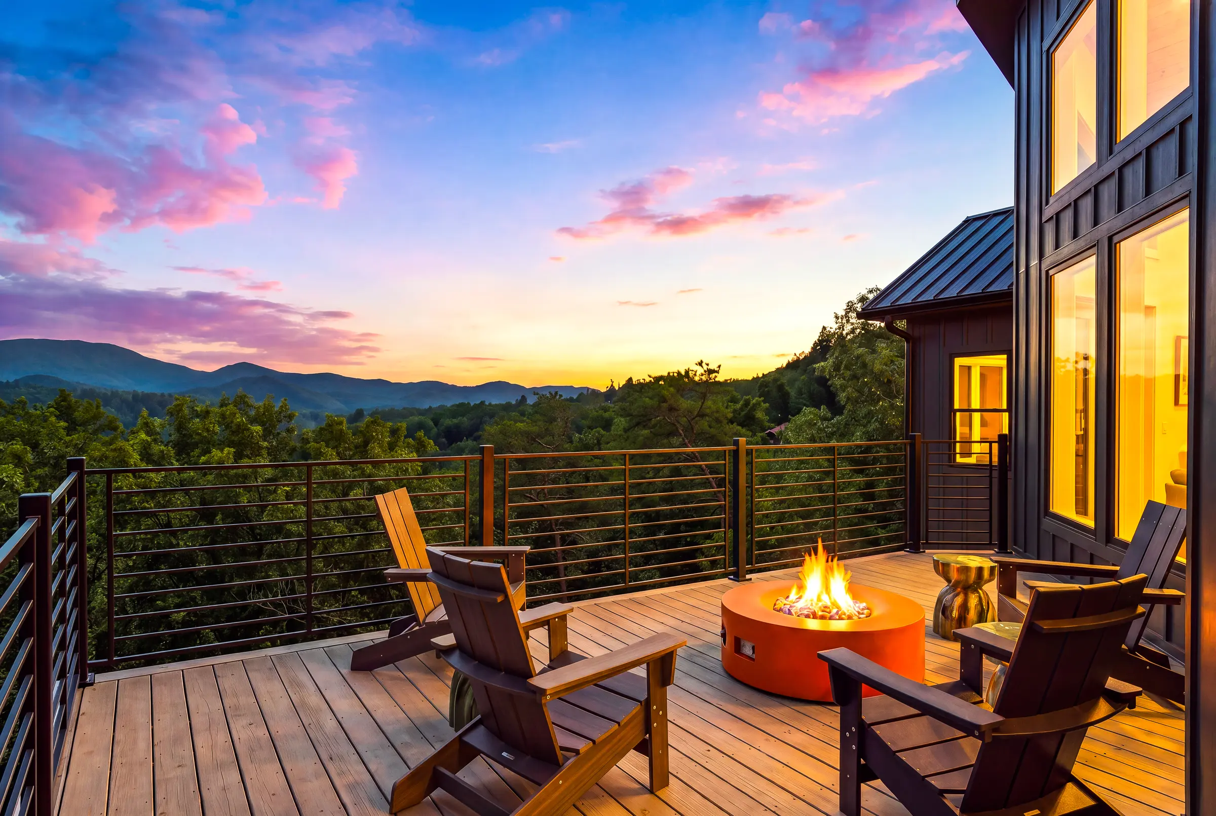 Fire table and outdoor seating above the mountain view at twilight