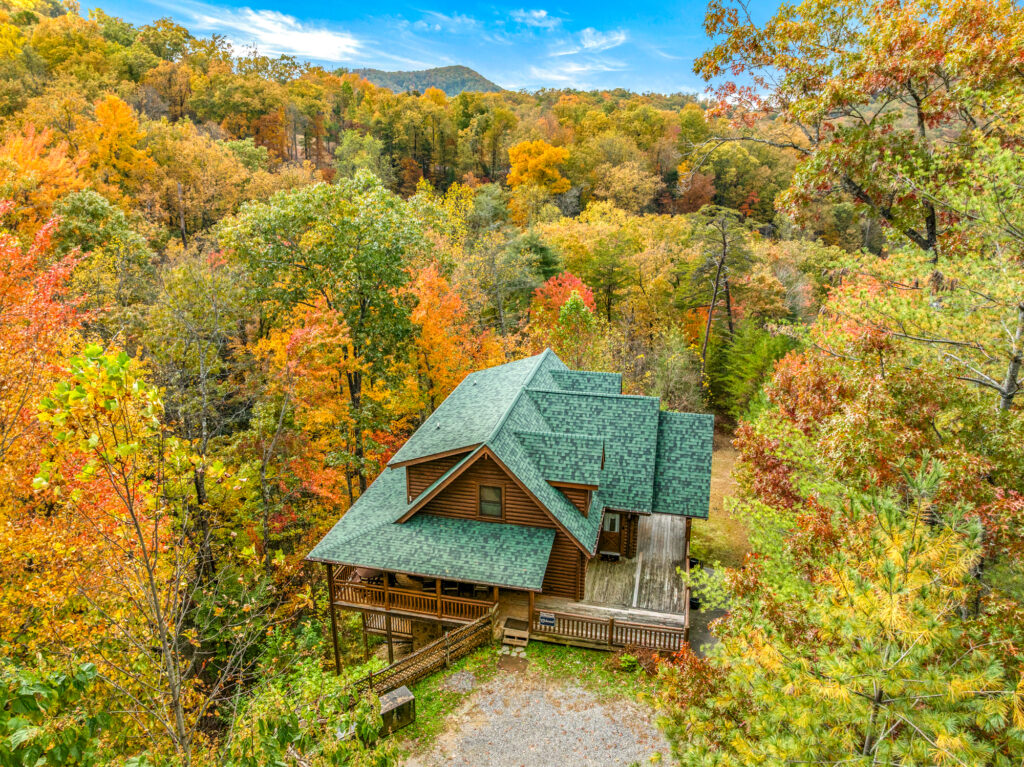 Aerial drone shot of an STR cabin photographed in Sevierville TN during fall season