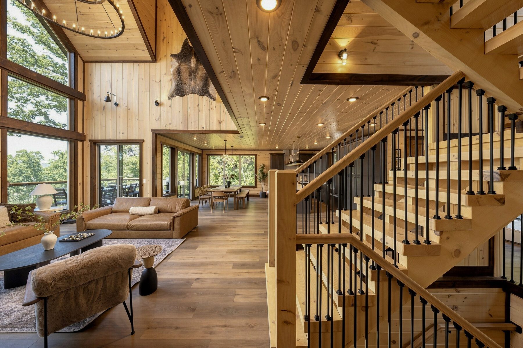 The staircase mediating between the great room and upper level