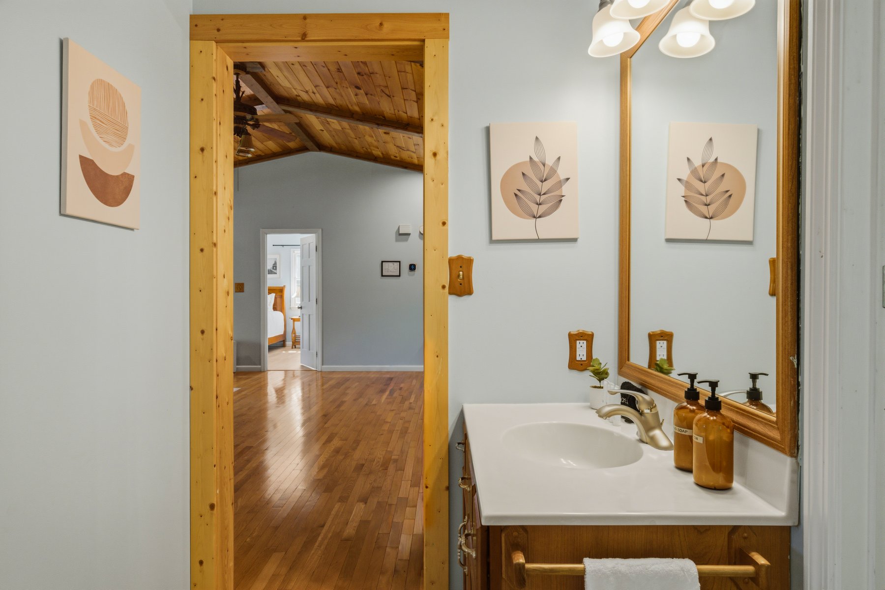Bathroom vanity framed by natural timber trim