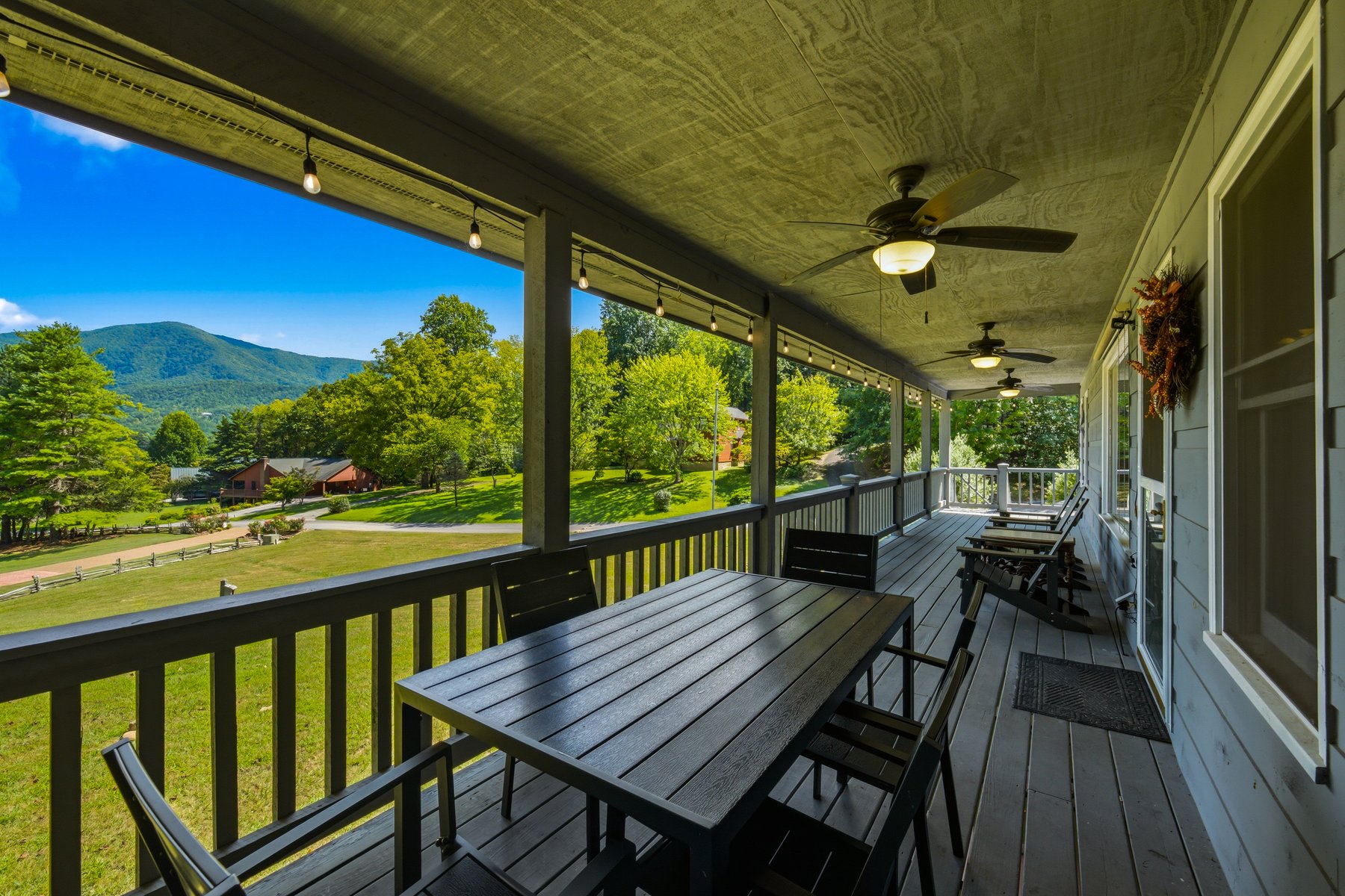 Covered porch dining area overlooking Wears Valley