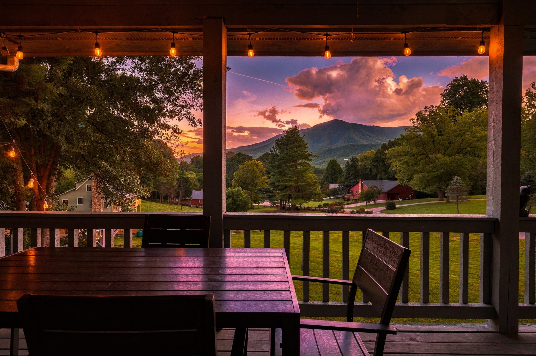 Porch table framing the mountains at sunset