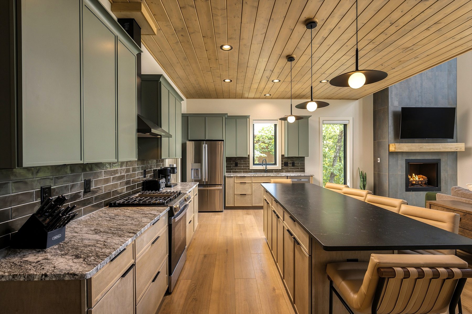 Galley perspective connecting the kitchen to the fireplace