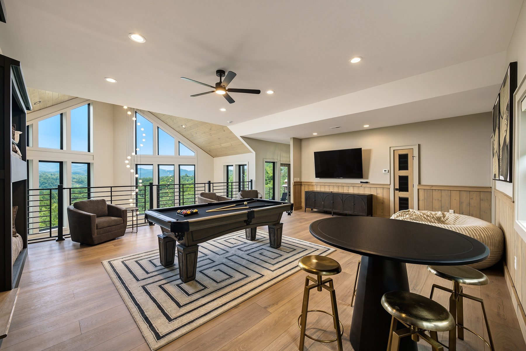 Loft game room with billiards, round table, and mountain views