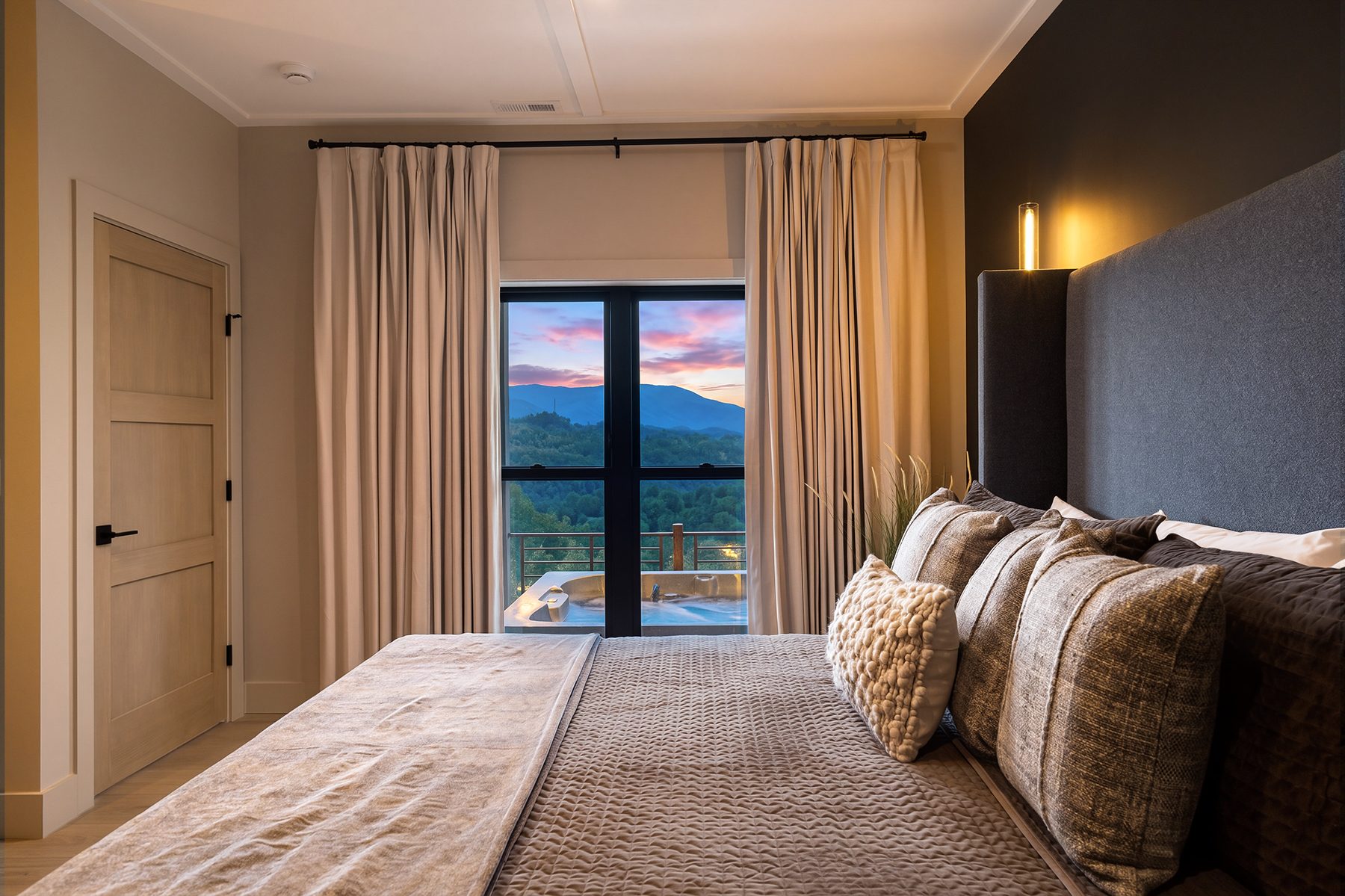Second bedroom with a framed view beyond the bed