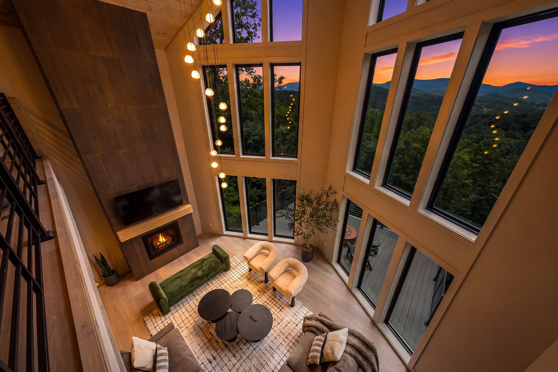 Twilight falling across the great room and its window wall