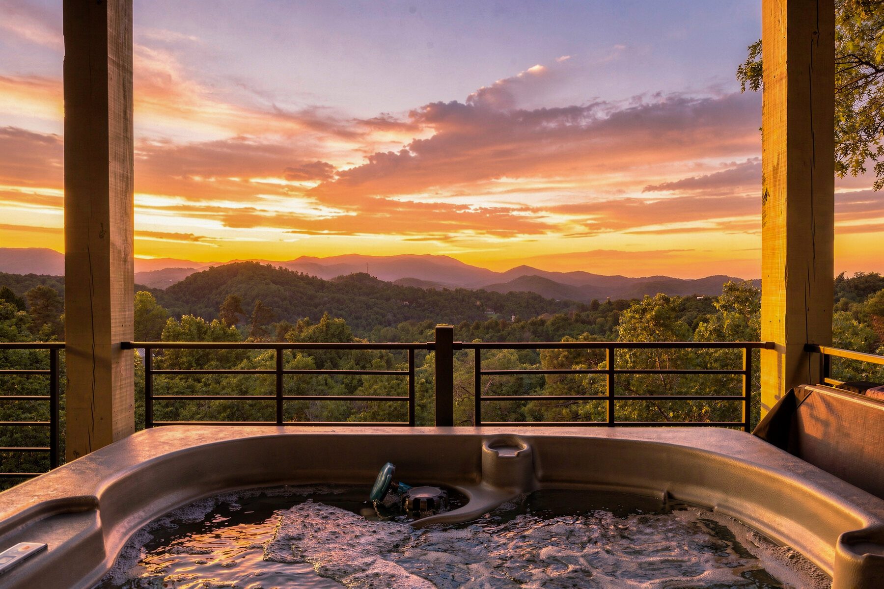 Mountain sunset stretching beyond the edge of the hot tub