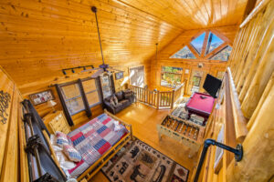 Shooting down on bedroom and game room loft at an STR listing with amazing mountain views photographed in Sevierville TN