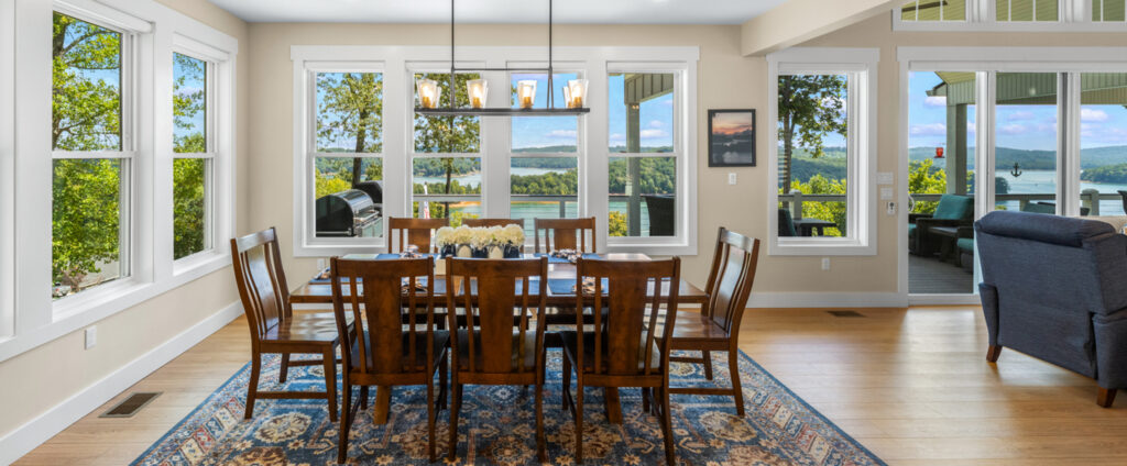 dining area with lake and mountain views