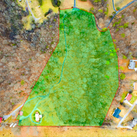 Drone shot of a real estate listing with property border overlays