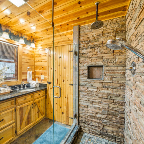Cabin Bathroom with Stone Shower and Wood Vanity &ndash; Sevierville Tennessee