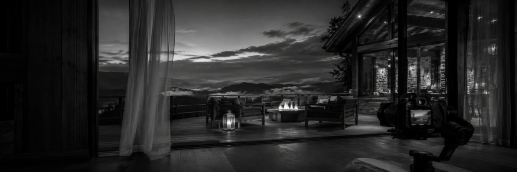 Black-and-white image of a luxury cabin deck in the Smoky Mountains